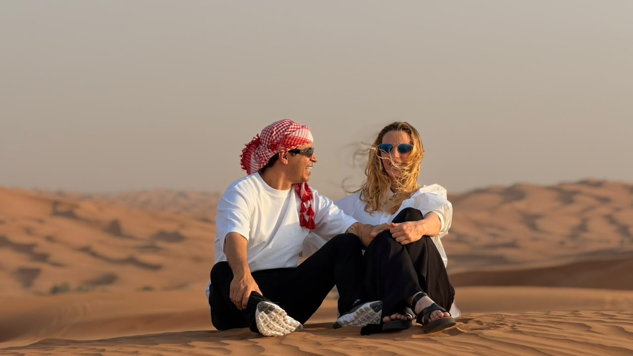 Couple enjoying a private desert safari at sunset
